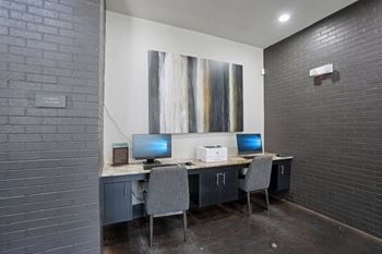 Business center with dual workstations and printer